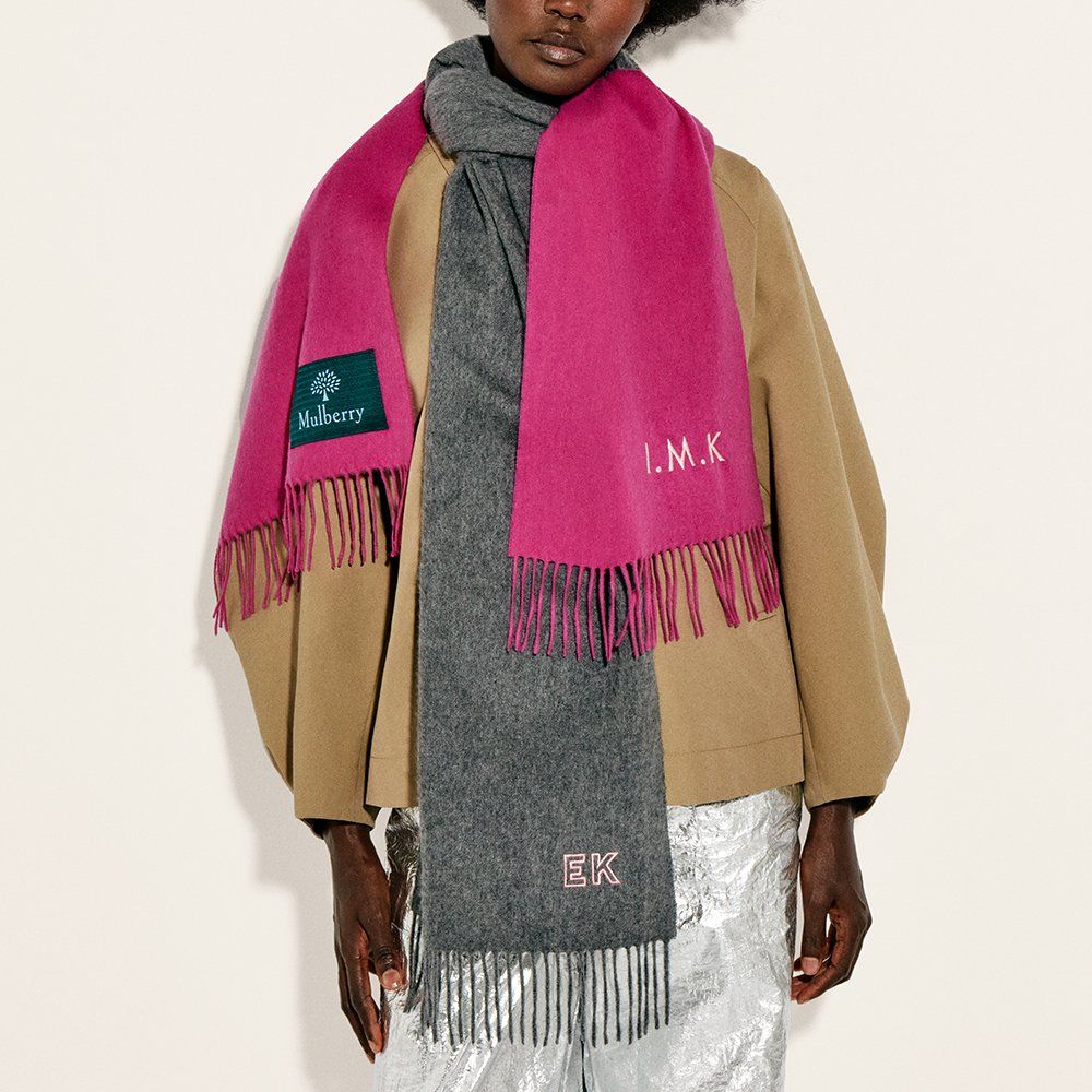 Model wearing Mulberry personalised scarves in Mulberry Pink and Charcoal